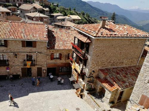 an aerial view of a village with buildings at Cal Armengou in Castellar de NʼHug