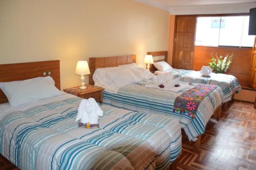 Katil atau katil-katil dalam bilik di Hostal Wasichay