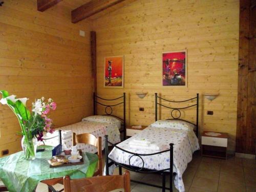 Postel nebo postele na pokoji v ubytování BeB Casa Di Lety