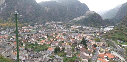 a small town in a valley with mountains at Ristoro Saint Roch in Hone