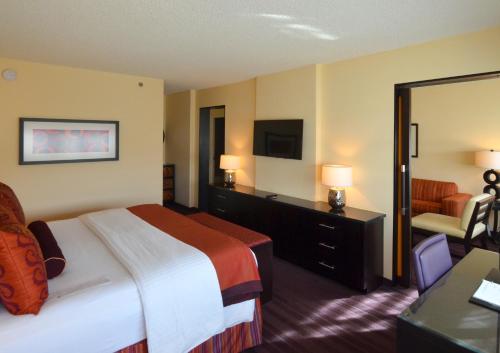 a hotel room with a bed and a couch at Washington Plaza Hotel in Washington