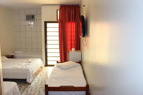 Voodi või voodid majutusasutuse Bica Pau Hotel toas