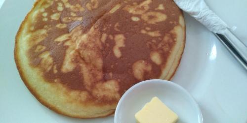 a pancake on a plate with a piece of cheese at MR Holidays Hotel in Boracay