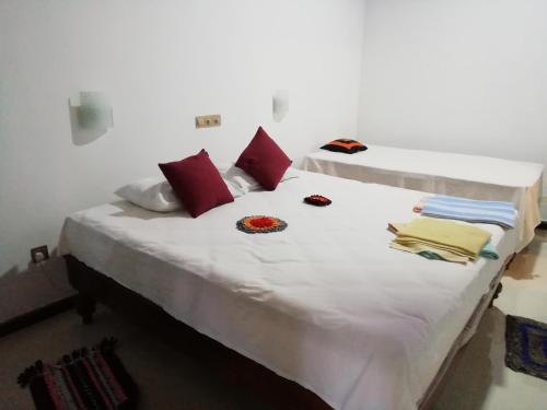 Postel nebo postele na pokoji v ubytování Lak Nilla Guest House