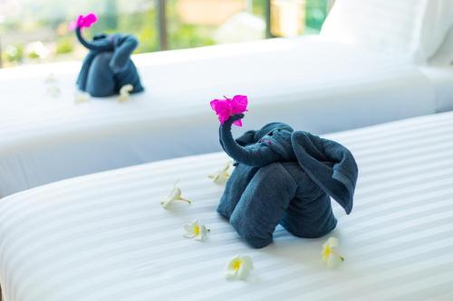 three toy elephants on top of a cake at Baan Saint-Tropez Seaview Villas Kata Beach in Kata Beach