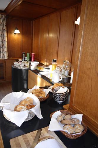 a kitchen with several baskets of pastries on a counter at Gasthof Wäscherschloss in Wäschenbeuren