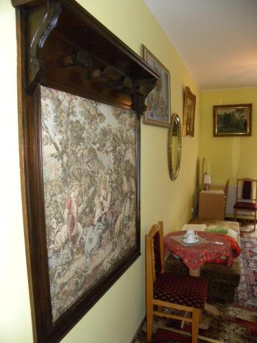 a large tapestry hanging on a wall in a room at Dom Wypoczynkowy Admirał in Karpacz