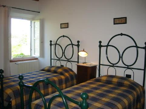 Postel nebo postele na pokoji v ubytování Il Casalone