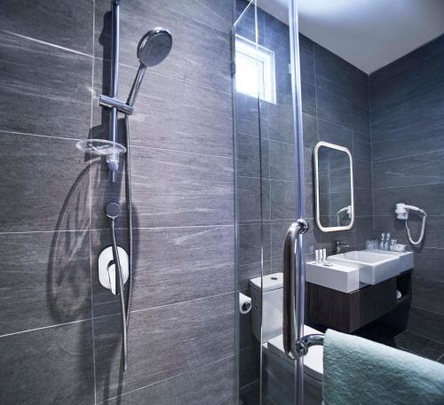 Koupelna v ubytování Urban H Hotel