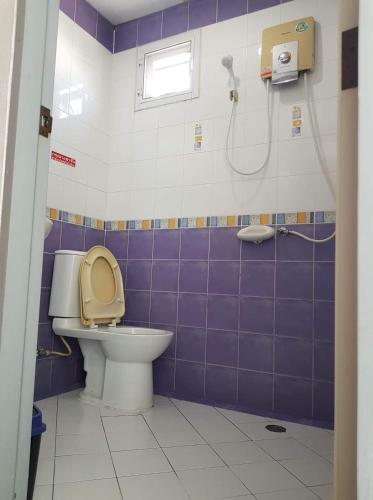 a bathroom with a toilet and a shower at Chill Inn in Pattaya