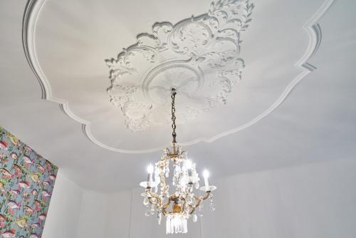 a chandelier hanging from a ceiling in a room at Leuhusen Collection Vienna, Wien in Vienna