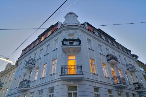 a building with a yellow light on the side of it at Leuhusen Collection Vienna, Wien in Vienna