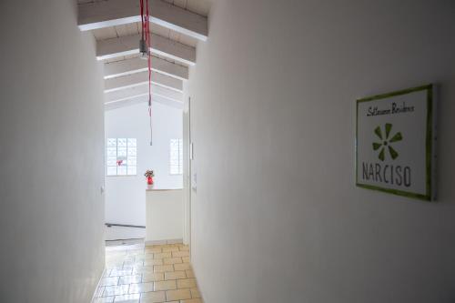 a hallway with white walls and a white ceiling at Settessenze Residence & Rooms in Agropoli