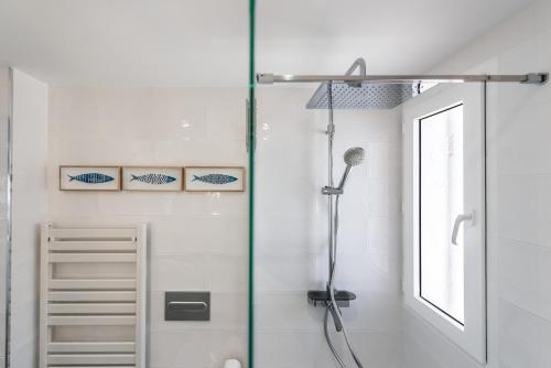 a shower with a glass door in a bathroom at Martí in Calpe