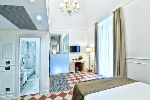 Ένα ή περισσότερα κρεβάτια σε δωμάτιο στο Casa Isabella Exclusive Hotel