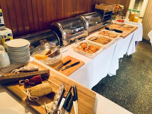 a buffet table with bread and pastries on it at Hotel Torres Manlleu in Manlleu