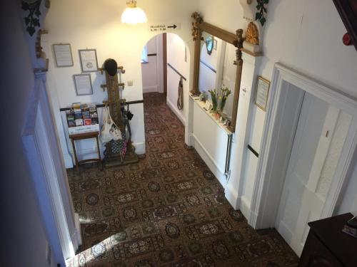a hallway with a door leading to a kitchen at Holly Lodge in York