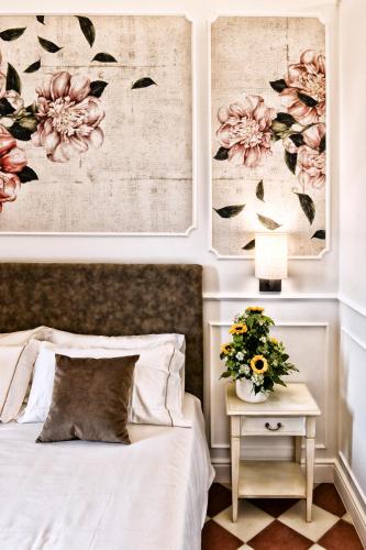 Ένα ή περισσότερα κρεβάτια σε δωμάτιο στο Casa Isabella Exclusive Hotel