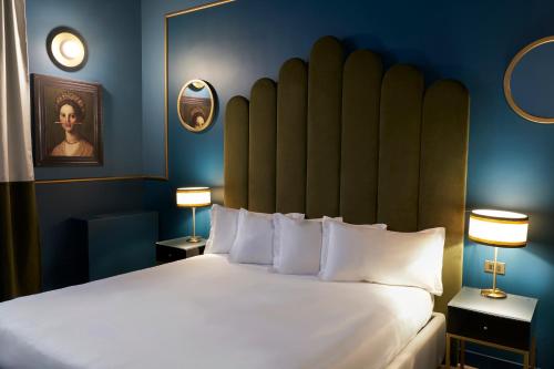 Кровать или кровати в номере Clerici Boutique Hotel