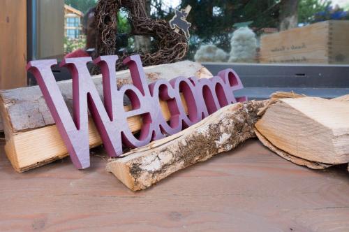 a wooden sign that says winter sitting on a table at Chalet Fantasia in Zermatt