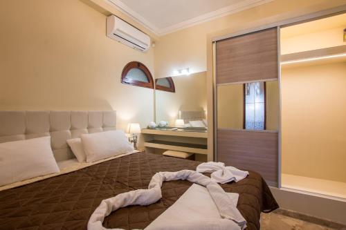 Postel nebo postele na pokoji v ubytování Paradise Bar Apartments