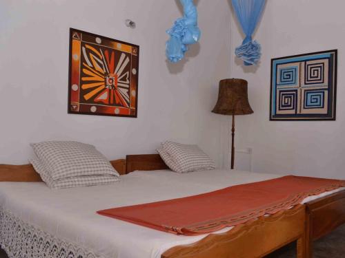 Postel nebo postele na pokoji v ubytování Sujatha's Homestay Residence