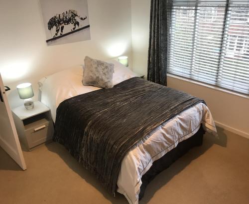 a bedroom with a bed and a window at Church Lane in Newcastle upon Tyne