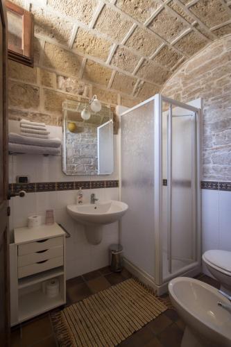 a bathroom with a shower and a sink at MASSERIA CITULO Il Pino grande in Castel del Monte