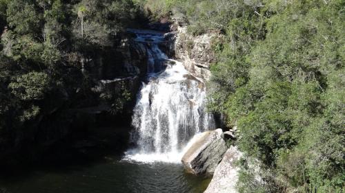 a waterfall in the middle of a river at Hotel Fazenda Itáytyba in Tibagi