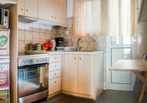 Kuchyňa alebo kuchynka v ubytovaní Fix Divine Apartment