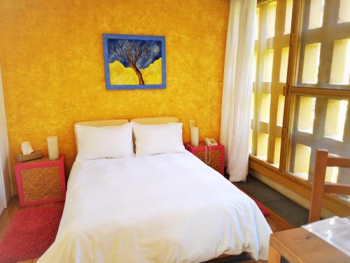 Postel nebo postele na pokoji v ubytování Hotel Casa en el Campo