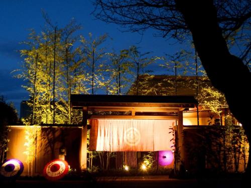 a small house with christmas lights in the night at Kafutei in Yamaga