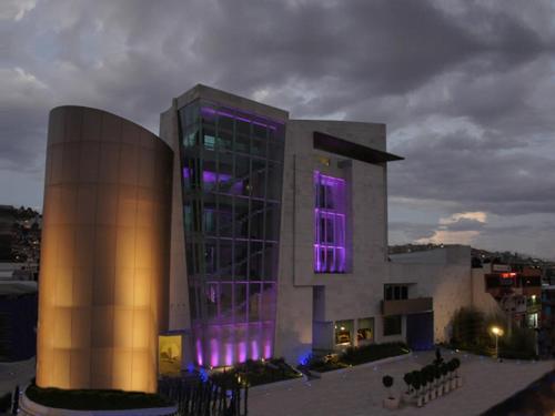a building with purple lights in front of it at HOTEL MADEIRA in Mexico City