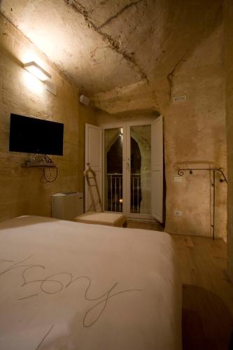 Katil atau katil-katil dalam bilik di L'Hotel In Pietra