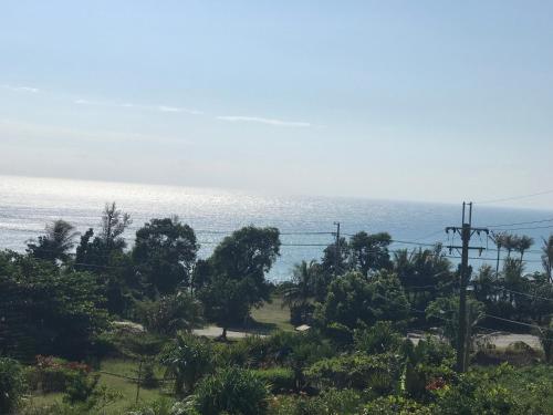 a view of the ocean from a resort at Wishingwell B&B in Donghe