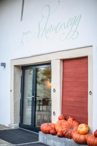 a bunch of pumpkins sitting in front of a garage at Bad Schauenburg in Liestal