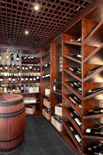 a wine tasting room with a barrel and wine bottles at Phi Phi CoCo Beach Resort in Phi Phi Don