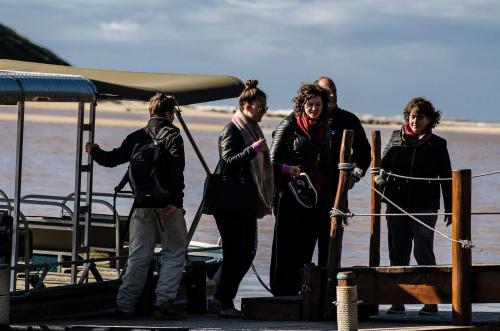 a group of people standing on a boat at Sibuya Game Reserve and Lodge in Kenton on Sea