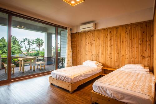 Postel nebo postele na pokoji v ubytování Galeum Guesthouse