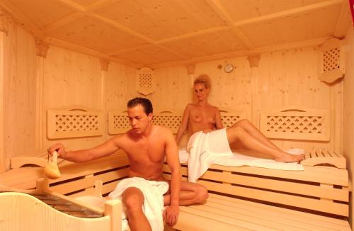 a man and a woman in a sauna at All Inclusive Hotel Bachmayerhof in Uderns