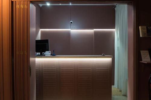 a garage door with a light on top of it at Aklidi Hotel in Mytilini