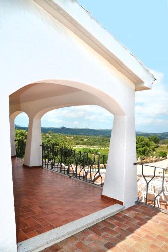 a view from the balcony of a house at Sardinia Family Villas - Villa Brunilde with private pool in Arzachena