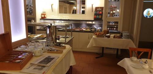 a restaurant with two tables with food on them at Dreimädelhaus - Kirchseelte in Kirchseelte