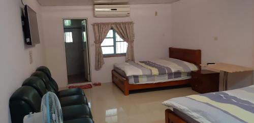 En eller flere senge i et værelse på Cishan San-Ho-Yuan