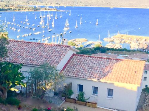 a view of a harbor with boats in the water at Les Villas MarInCelu in Porto Pollo