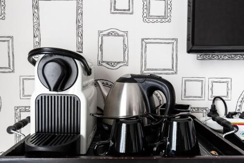 a kitchen sink with a tea pot and a tea kettle at Domaine du Grand Bec in Villerville