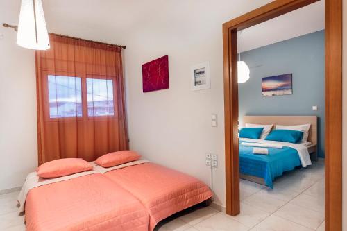 a bedroom with a bed and a mirror at Omega Comfy Apartments Almyrida in Almyrida