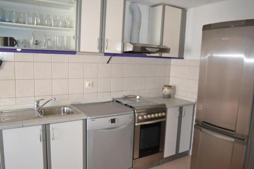 Kuchyň nebo kuchyňský kout v ubytování Apartment Lavinia