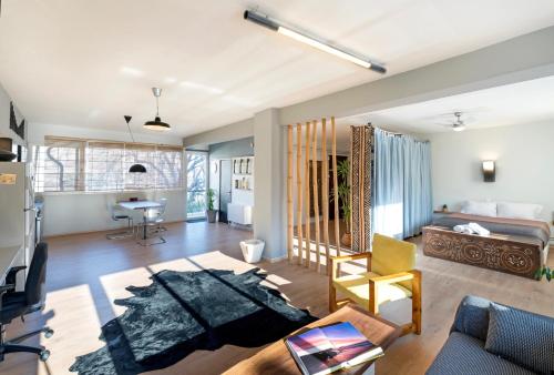 a living room with a couch and a table at Comfort Stay Lofts in Athens