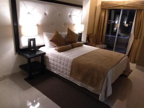 Katil atau katil-katil dalam bilik di Hermoso Depto por UACH II Con Terraza y linda vista